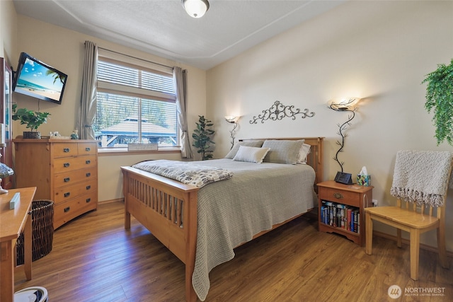 bedroom featuring wood finished floors