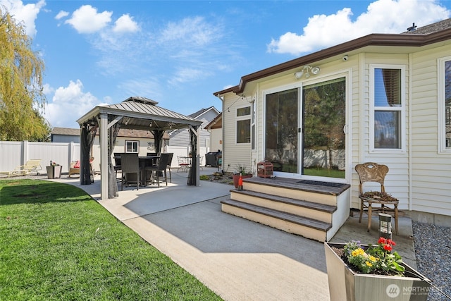 view of patio featuring a gazebo and fence