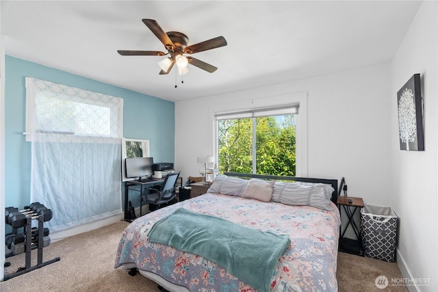 carpeted bedroom featuring a ceiling fan and baseboards