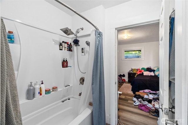 bathroom with shower / bath combo with shower curtain