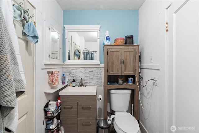 bathroom with toilet and vanity