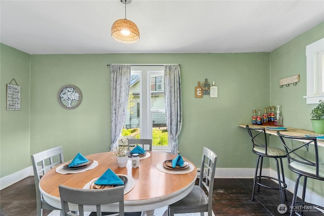dining area with baseboards and a wealth of natural light