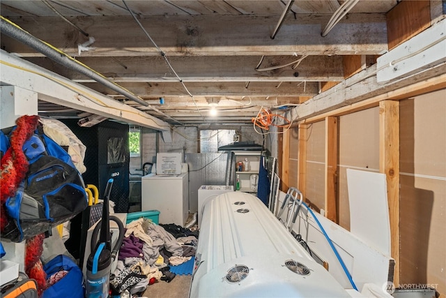 below grade area featuring washer and clothes dryer