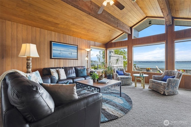 living room featuring vaulted ceiling with beams, a ceiling fan, carpet, and wood ceiling