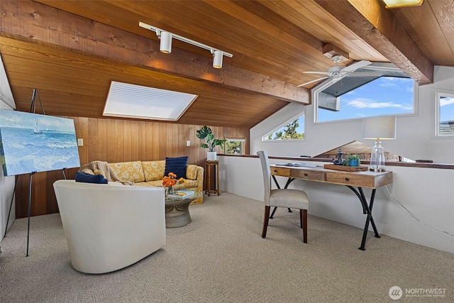 interior space with wood ceiling, ceiling fan, carpet floors, wooden walls, and vaulted ceiling with beams
