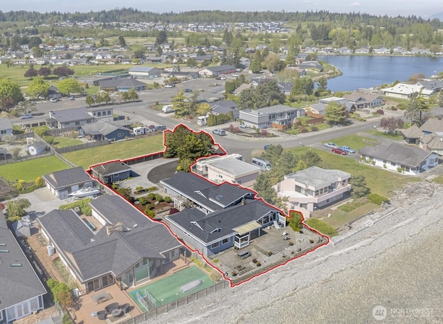 birds eye view of property featuring a residential view and a water view