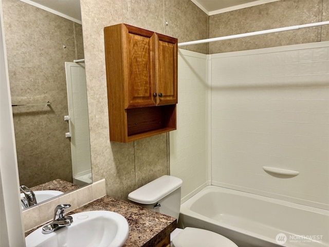 bathroom with crown molding, tub / shower combination, toilet, and vanity