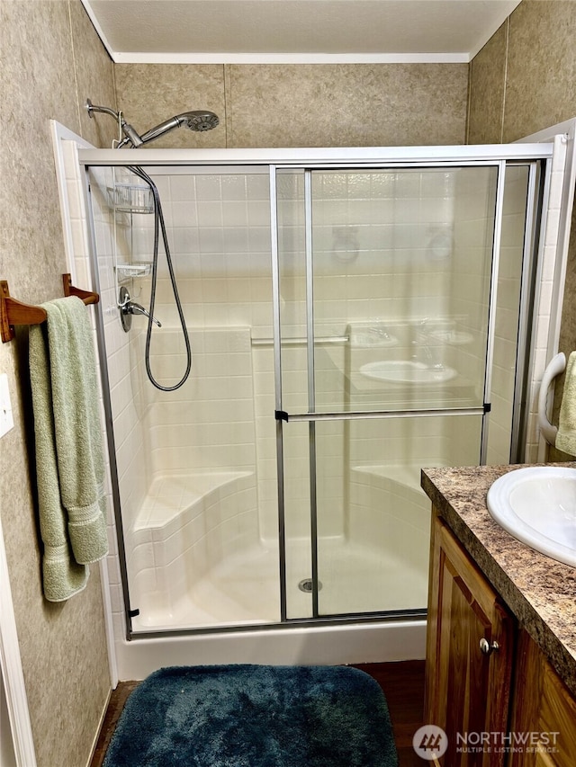 full bath featuring a shower stall and vanity