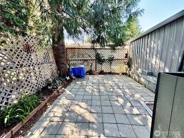 view of patio featuring fence