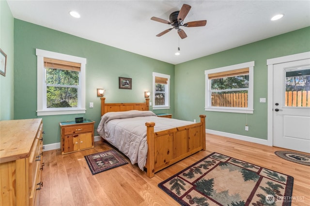 bedroom with recessed lighting, baseboards, and light wood-style flooring