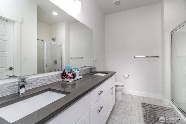 6318 230th Avenue Ct E, Buckley, WA 98321 - bathroom with baseboards, a stall shower, and a sink