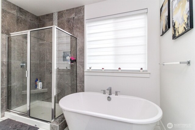 6318 230th Avenue Ct E, Buckley, WA 98321 - bathroom featuring a shower stall and a soaking tub