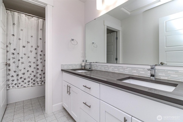 6318 230th Avenue Ct E, Buckley, WA 98321 - bathroom featuring shower / tub combo, a sink, double vanity, and tasteful backsplash