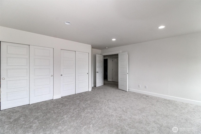 6318 230th Avenue Ct E, Buckley, WA 98321 - unfurnished bedroom featuring recessed lighting, two closets, carpet flooring, and baseboards