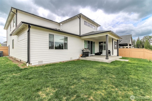6318 230th Avenue Ct E, Buckley, WA 98321 - rear view of house with a yard, fence, a patio area, and crawl space
