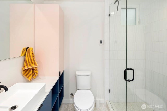 2305 E Alder St, Seattle, WA 98122 - full bathroom with vanity, toilet, baseboards, and a stall shower