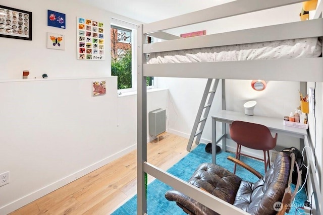 2305 E Alder St, Seattle, WA 98122 - bedroom featuring baseboards and wood finished floors