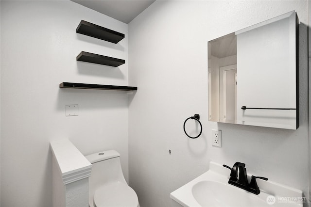 240 Willow St, Bremerton, WA 98310 - half bathroom featuring a sink and toilet