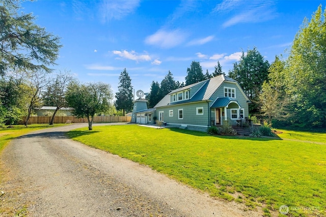 1812 N Pearl St, Centralia, WA 98531 - view of front of property with a gambrel roof, a front lawn, dirt driveway, fence, and metal roof