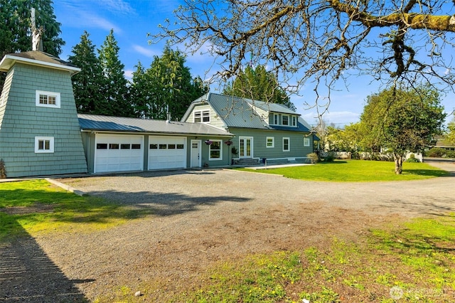 1812 N Pearl St, Centralia, WA 98531 - view of front facade featuring dirt driveway, a front lawn, metal roof, and an attached garage