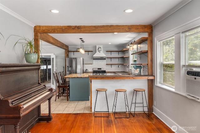 1812 N Pearl St, Centralia, WA 98531 - kitchen featuring custom exhaust hood, open shelves, a breakfast bar area, stainless steel appliances, and backsplash