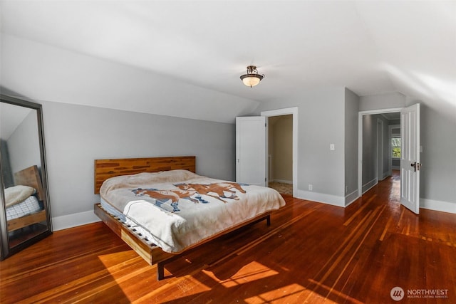 1812 N Pearl St, Centralia, WA 98531 - bedroom with vaulted ceiling, wood finished floors, and baseboards