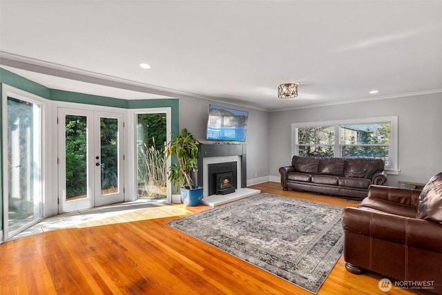 1812 N Pearl St, Centralia, WA 98531 - living area with a lit fireplace, ornamental molding, wood finished floors, and french doors