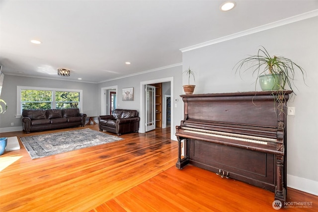 1812 N Pearl St, Centralia, WA 98531 - living area featuring wood finished floors, recessed lighting, and crown molding