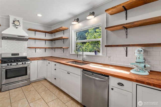 1812 N Pearl St, Centralia, WA 98531 - kitchen with open shelves, wooden counters, stainless steel appliances, and custom range hood