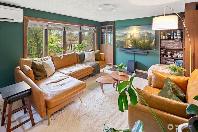 carpeted living room featuring an AC wall unit and a textured ceiling
