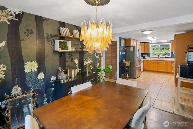 dining room with a notable chandelier and light wood-style floors