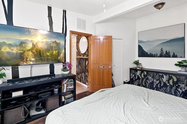 bedroom featuring visible vents