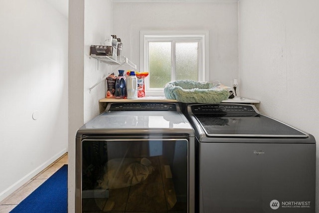 laundry room featuring independent washer and dryer, laundry area, and baseboards