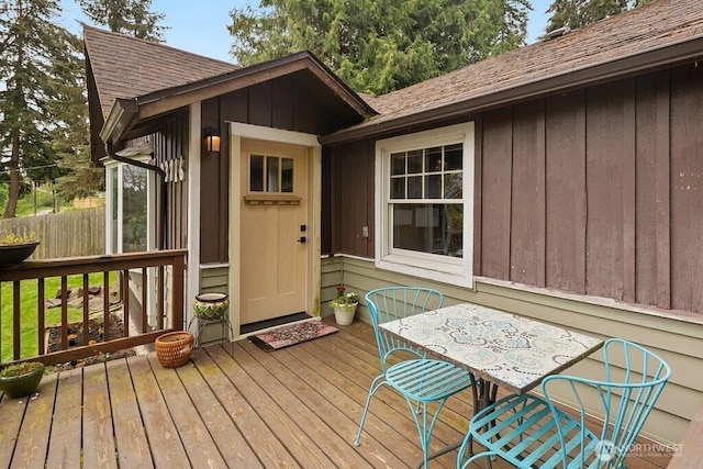 deck with fence and outdoor dining space