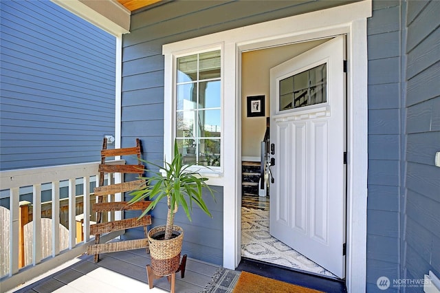 property entrance with covered porch