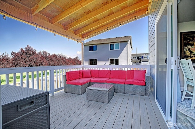 wooden deck with an outdoor living space