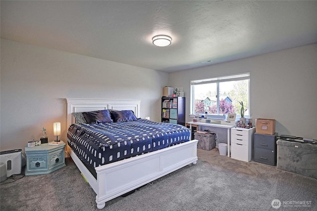 bedroom with visible vents and carpet