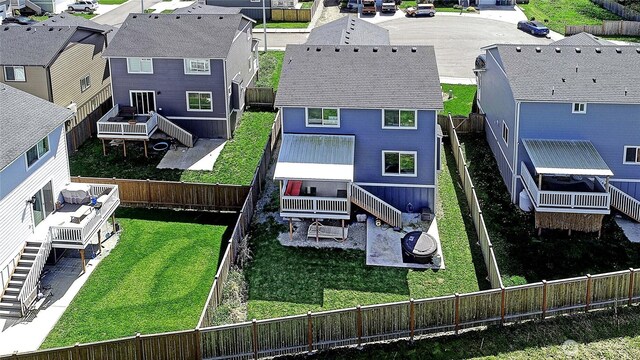 birds eye view of property with a residential view