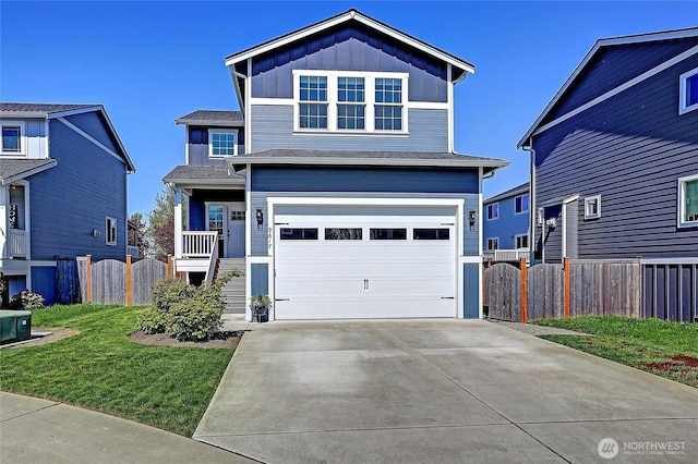 view of front facade featuring a front yard, driveway, board and batten siding, an attached garage, and fence