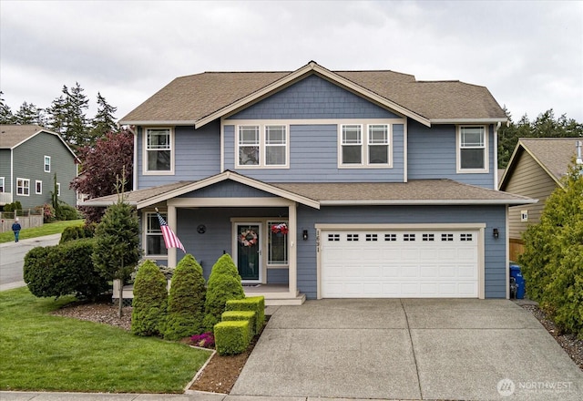 view of front of home with a front lawn, covered porch, roof with shingles, an attached garage, and driveway