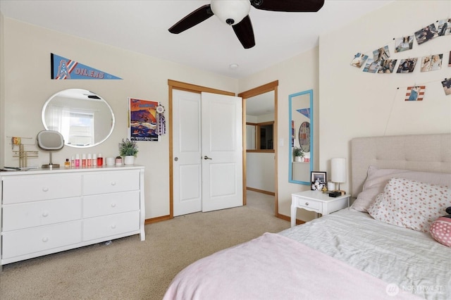 bedroom featuring baseboards, ceiling fan, and carpet