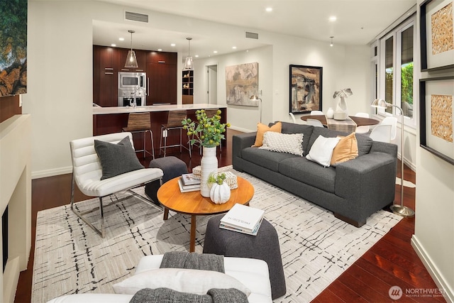 500 106th Ave NE Unit 611, Bellevue, WA 98004 - living area featuring hardwood / wood-style flooring, recessed lighting, and baseboards