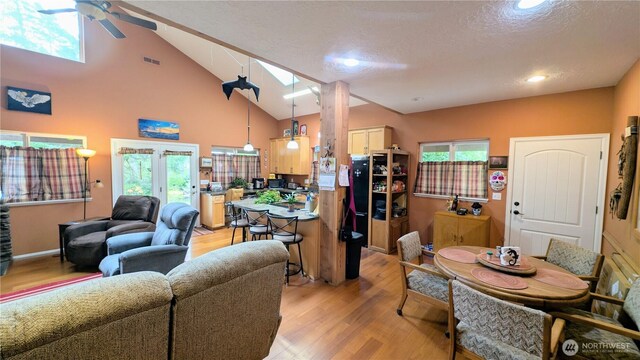 living room featuring recessed lighting, ceiling fan, and light wood finished floors