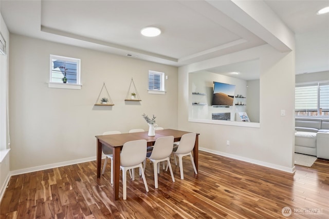 13218 106th Pl NE, Kirkland, WA 98034 - dining room with baseboards, a tray ceiling, wood finished floors, and visible vents