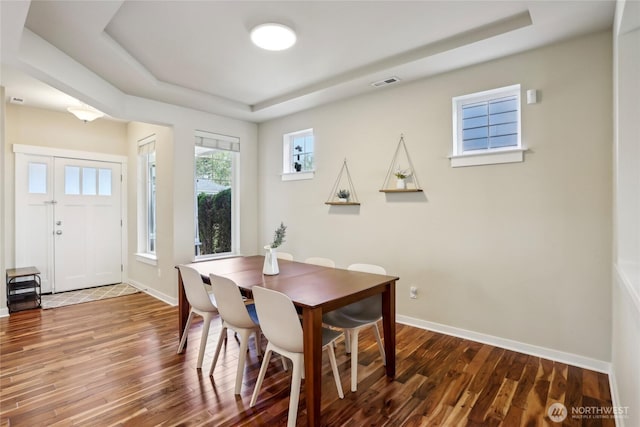 13218 106th Pl NE, Kirkland, WA 98034 - dining area featuring visible vents, wood finished floors, and a tray ceiling