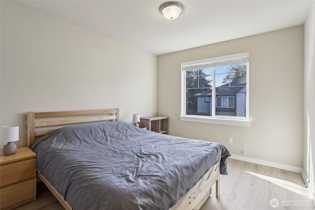 13218 106th Pl NE, Kirkland, WA 98034 - bedroom featuring baseboards and wood finished floors