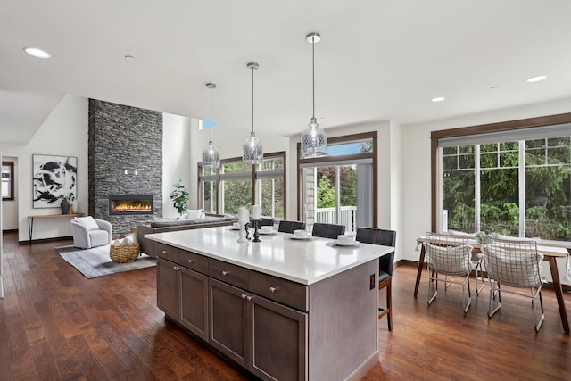 14835 NE 11th Pl, Bellevue, WA 98007 - kitchen featuring dark wood-style flooring, healthy amount of natural light, light countertops, and recessed lighting