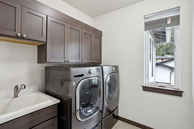14835 NE 11th Pl, Bellevue, WA 98007 - washroom with cabinet space, washing machine and dryer, and light tile patterned flooring