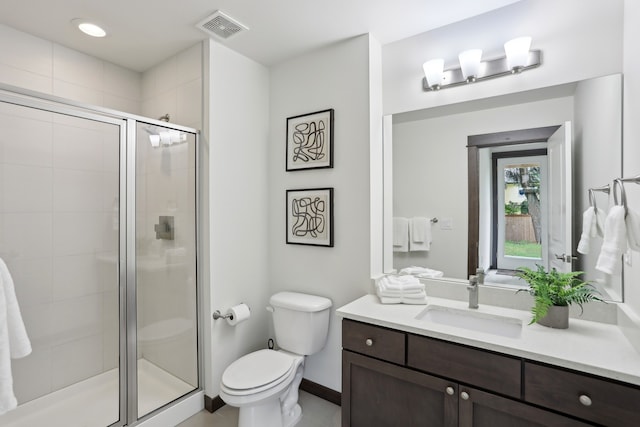 14835 NE 11th Pl, Bellevue, WA 98007 - bathroom featuring a shower stall, toilet, vanity, baseboards, and tile patterned floors