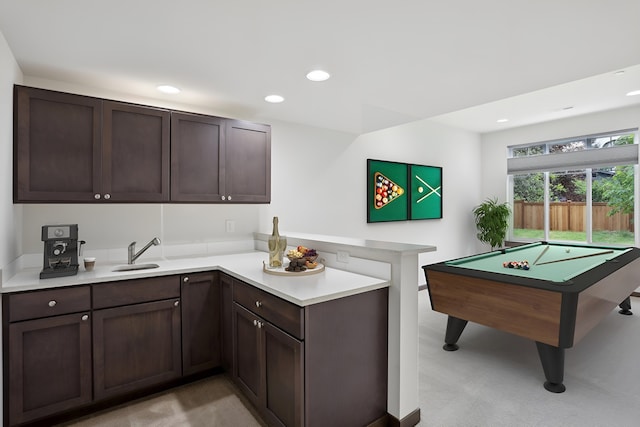 14835 NE 11th Pl, Bellevue, WA 98007 - kitchen featuring a peninsula, light countertops, recessed lighting, a sink, and dark brown cabinetry
